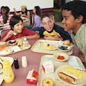 Four kids eating school lunches. California just became the first state to offer free breakfast and ...