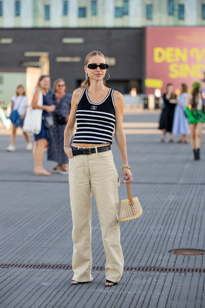 COPENHAGEN, DENMARK - AUGUST 11: Pernille Teisbaek seen wearing black white striped Chanel top, earr...