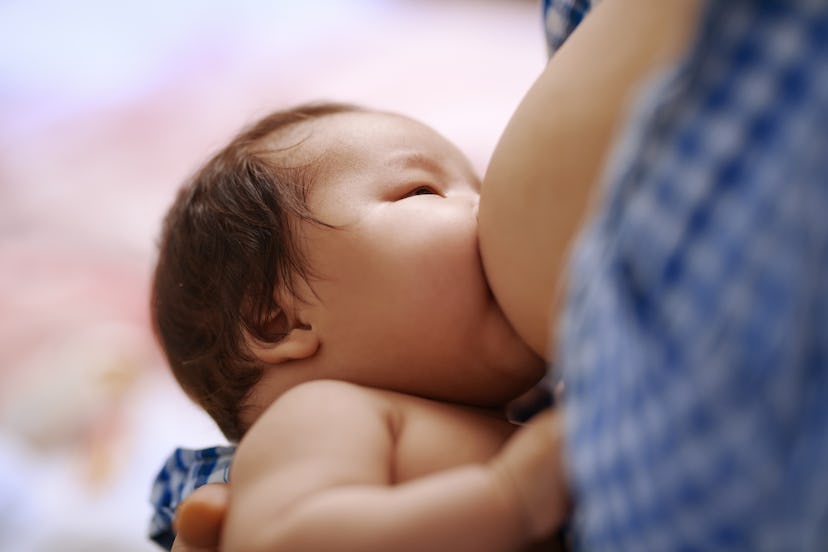 Mom breastfeeds her newborn baby in an article about can you get botox while breastfeeding?