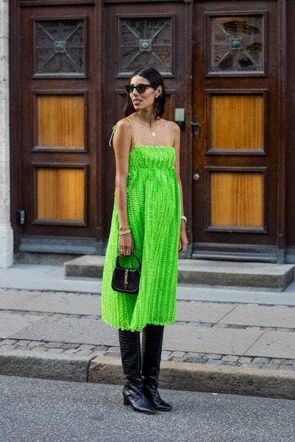 COPENHAGEN, DENMARK - AUGUST 10: Babba Rivera seen wearing green dress, black bag, boots outside Bau...