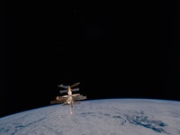 The Russian Space Station Mir backdropped against the darkness of space and the Planet Earth after M...