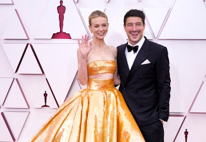 LOS ANGELES, CALIFORNIA – APRIL 25: (L-R) Carey Mulligan and Marcus Mumford attend the 93rd Annual A...