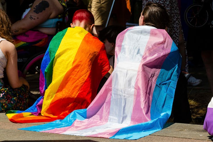 Protesters draped in Rainbow Pride and Transgender flags wait to take part in a London Trans+ Pride ...