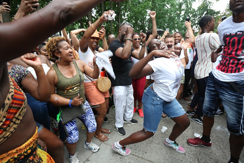 BROOKLYN, NY - AUG 4: People dance to House music performed by the Soul Summit DJ Collective during ...