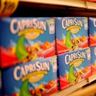 Boxes of Capri Sun juice sit on shelves at a grocery store