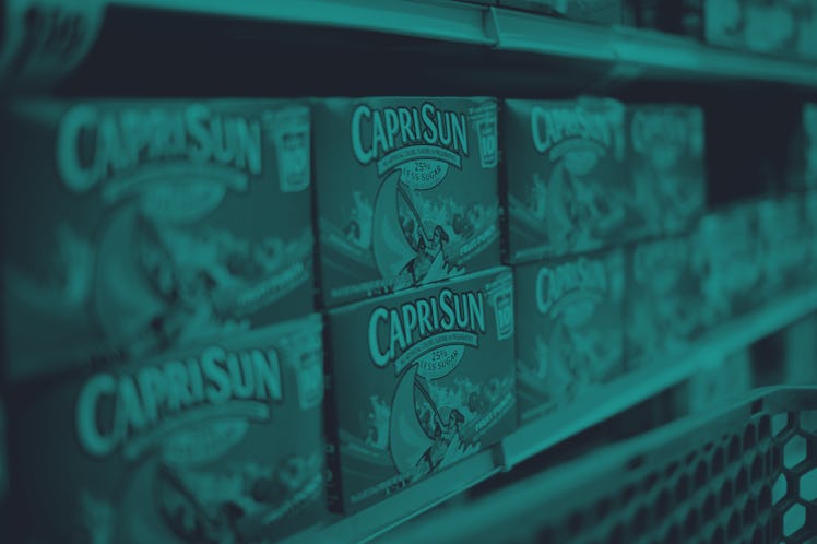 Boxes of Capri Sun juice sit on shelves at a grocery store