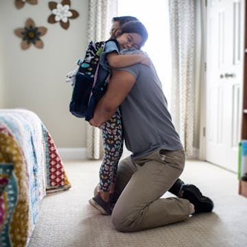 Dad comforting his daughter. A father took to Reddit's AITA to ask if he was the jerk for leaving hi...