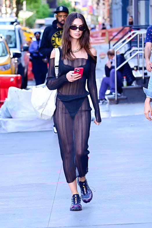 Emily Ratajkowski wearing a sheer black Coperni dress with Salomon Advanced Xt-6 Advanced Sneaker