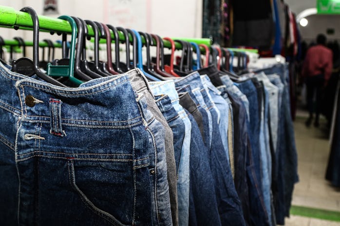 NAKURU, KENYA - 2022/07/16: Second-hand clothes, locally known as mitumba seen displayed in a shop. ...