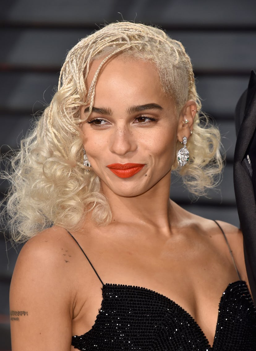 Zoe Kravitz with a side shave and a deep side part.