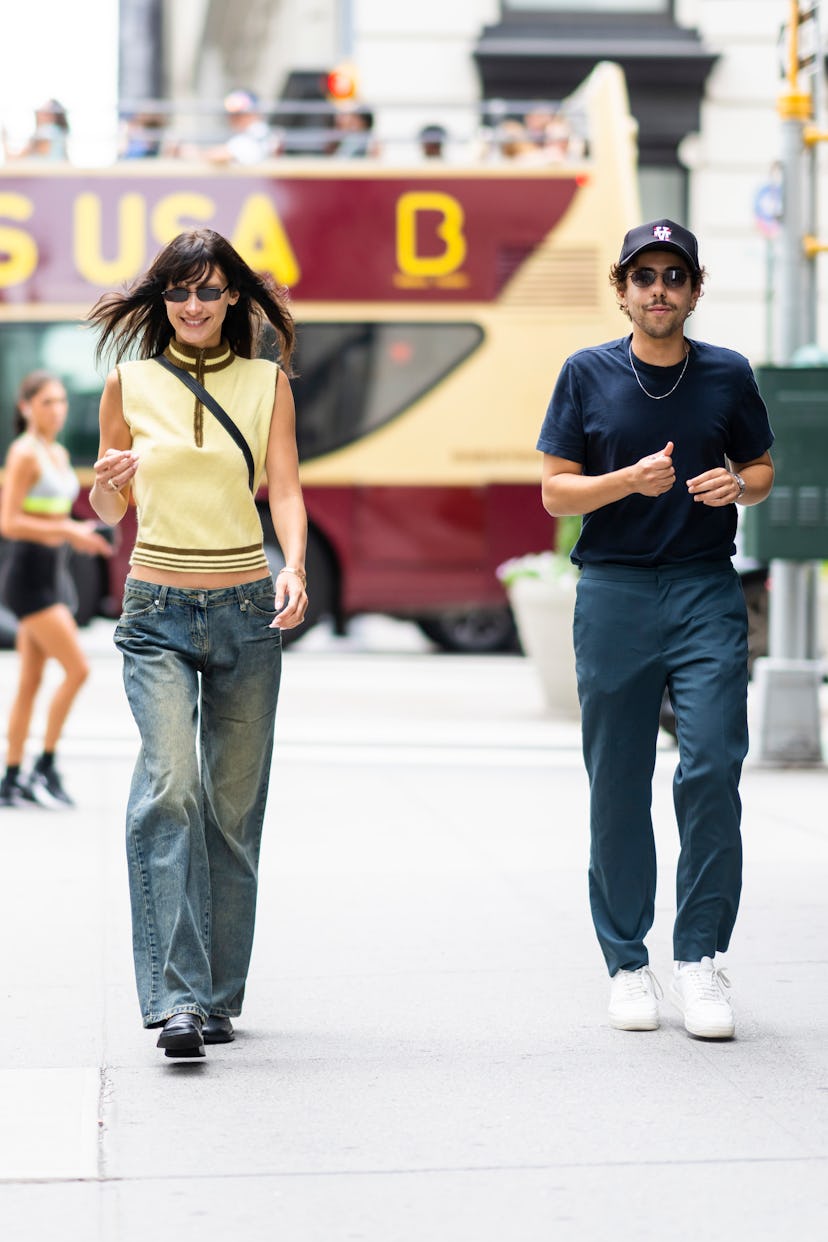Bella Hadid (L) and Ramy Youssef walking in New York City