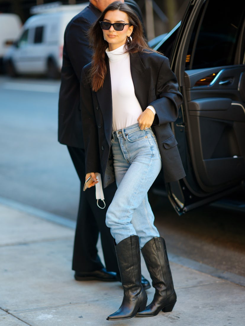 Emily Ratajkowski wearing black cowboy boots on November 09, 2021 in New York City