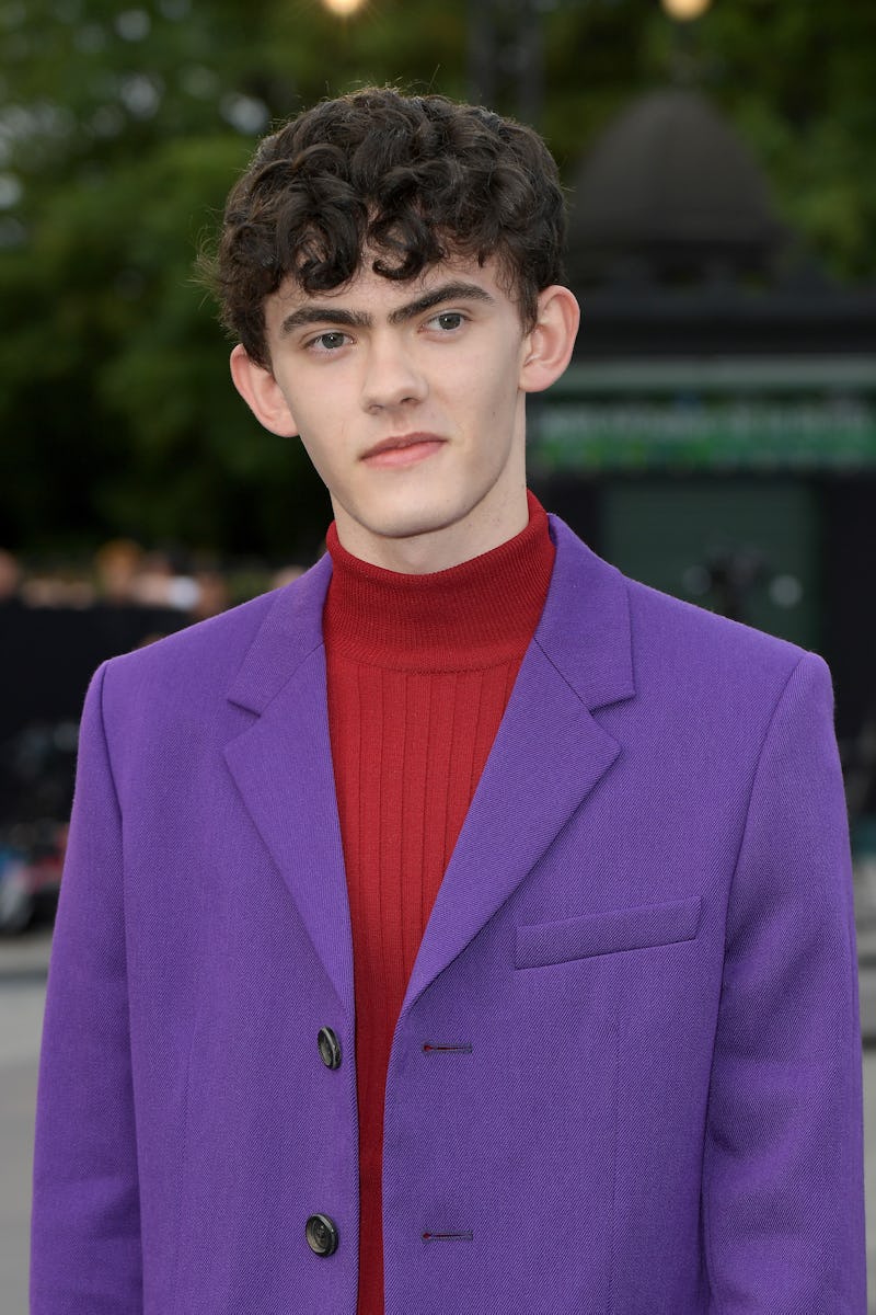 'Heartstopper' lead star Joe Locke, wearing a purple blazer over a burgundy turtleneck while posing ...