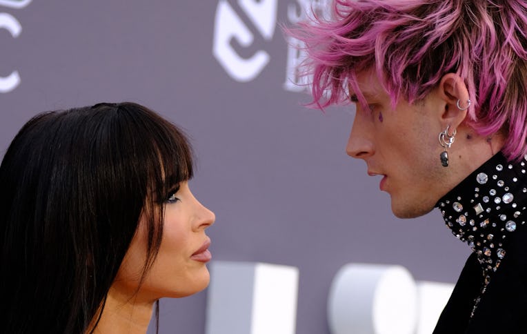 US rapper Machine Gun Kelly and US actress Megan Fox attend the 2022 Billboard Music Awards at the M...