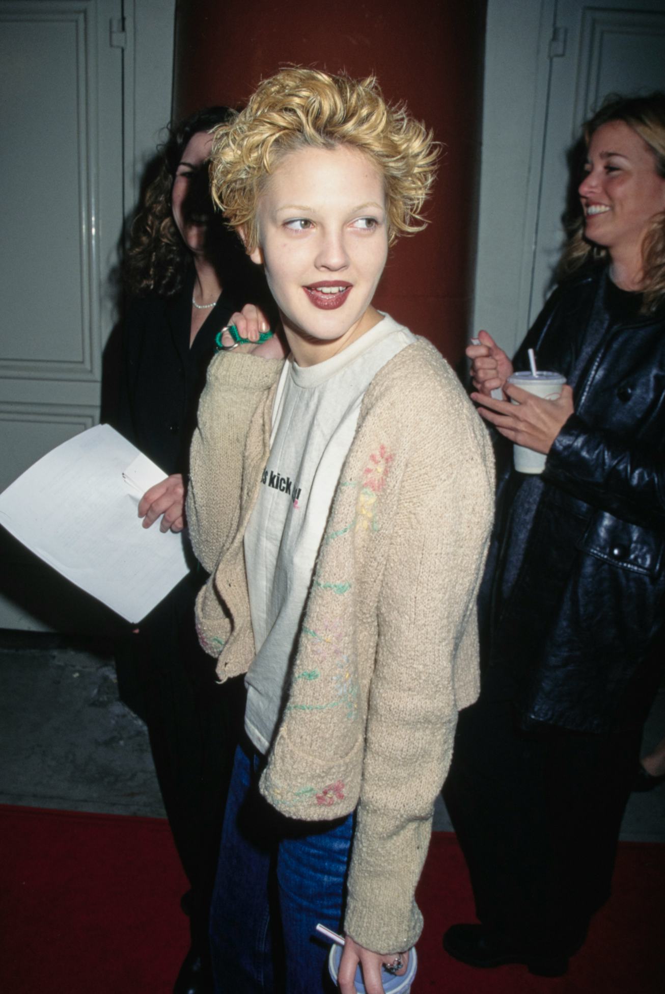 American actress Drew Barrymore, wearing a beige cardigan over a white t-shirt, attends the Westwood...