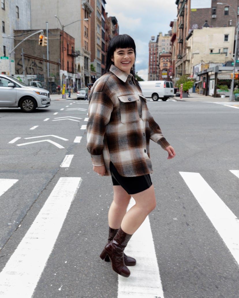 Barbie Ferreira wearing a flannel shirt with bike shorts and leather boots