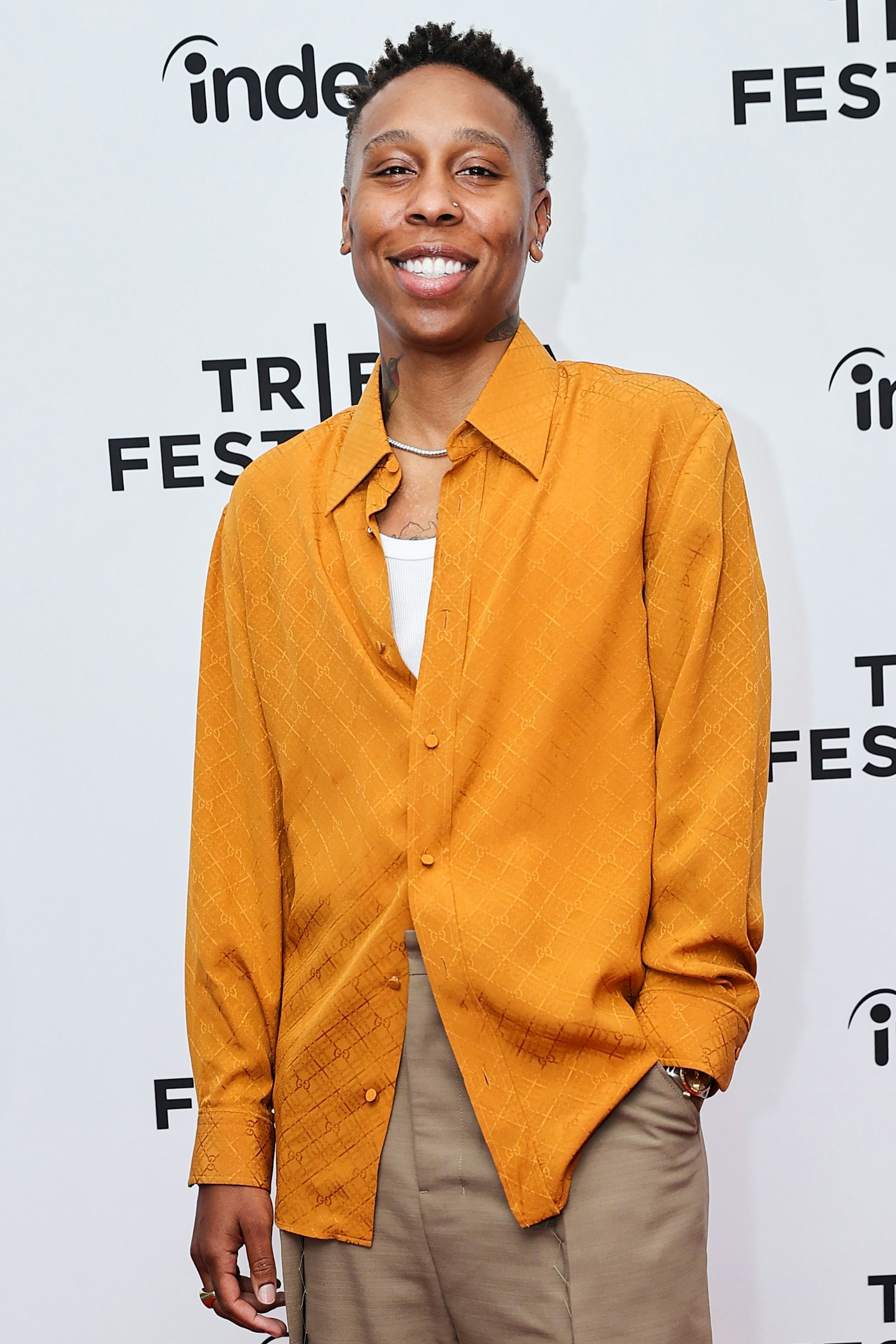 Lena Waithe wearing a golden gucci shirt