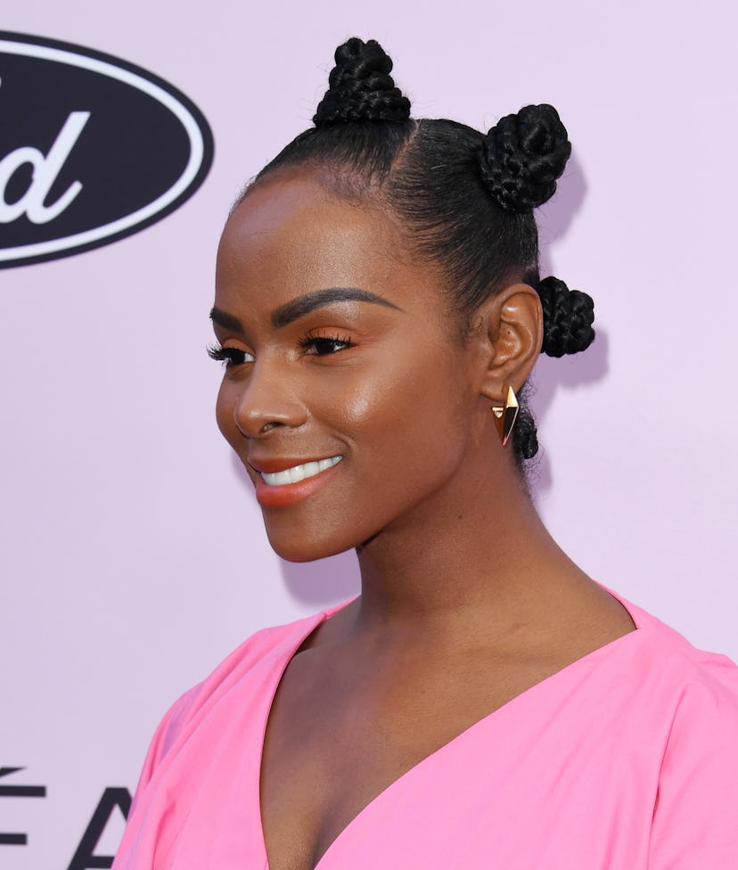 Tika Sumpter sports a braided Bantu knot hairstyle to the 13th Annual Essence Black Women In Hollywo...