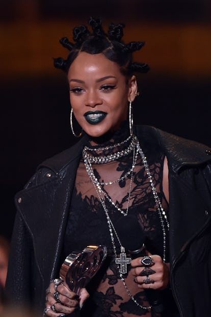Rihanna in 2014 wearing a straight updo with bantu knots.