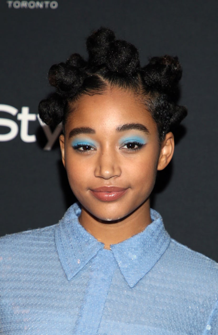 Amandla Stenberg rocked bantu knots and blue eyeshadow to The Hollywood Foreign Press Association an…