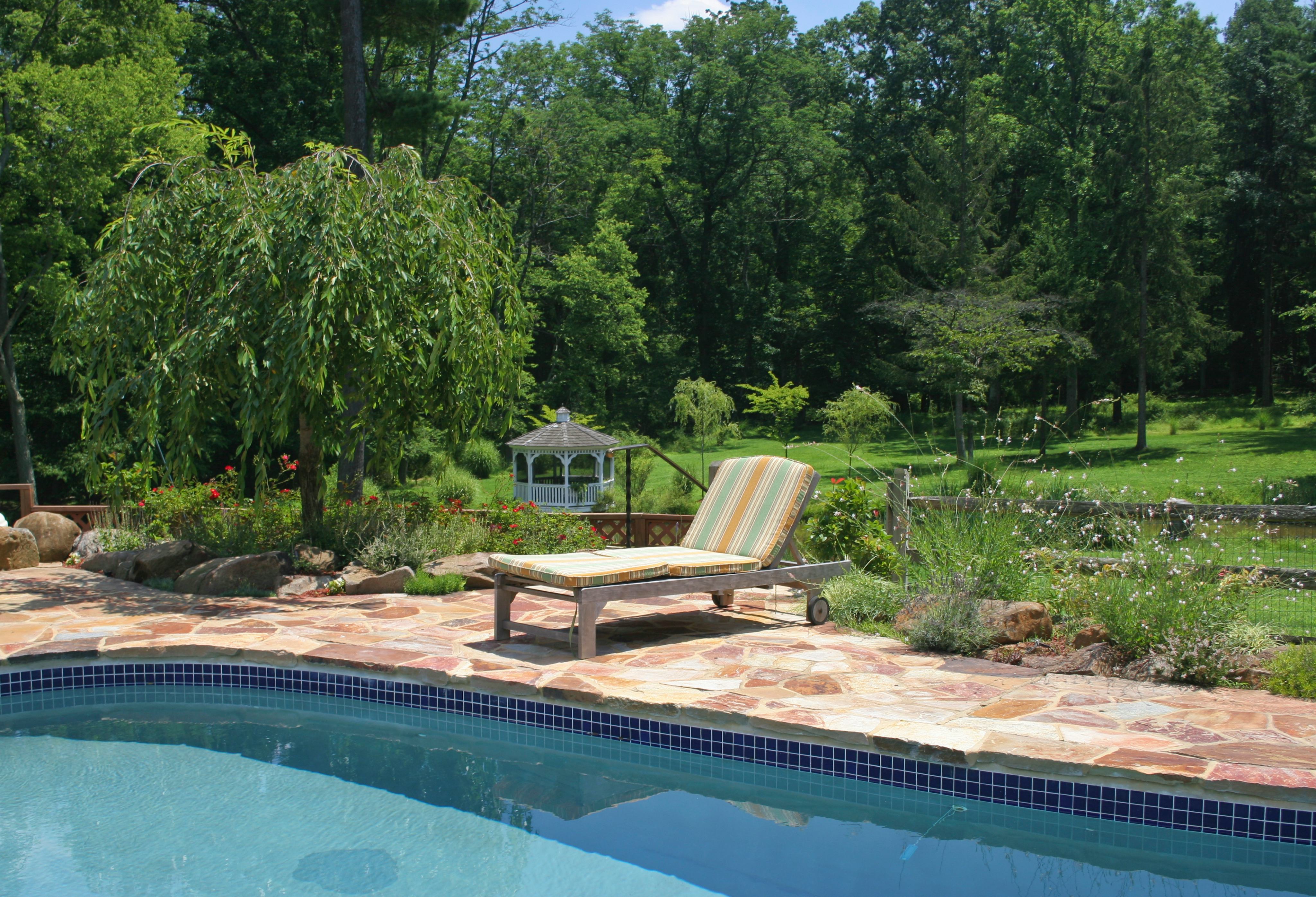 Sun lounger beside swimming pool