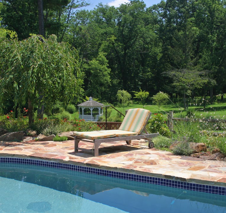 Sun lounger beside swimming pool
