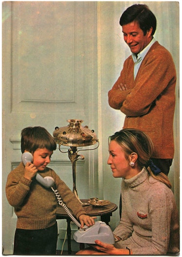 Postcard printed in Portugal shows happy parents are watching a boy who talking on the phone, Portug...
