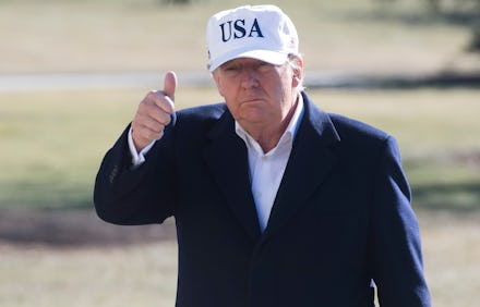 US President Donald Trump gives a thumbs-up as he walks from Marine One upon arrival on the South La...
