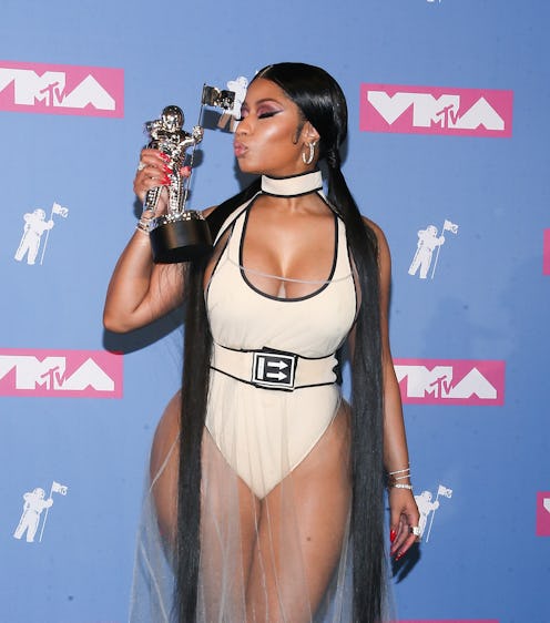 NEW YORK, NY - AUGUST 20: Rapper Nicki Minaj holds her award for best hip-hop video in the press ro...