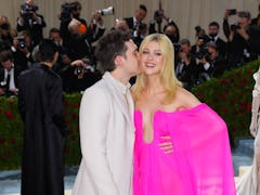 Nicola Peltz's post-wedding style includes bright colors as seen in this pink draped gown, at the 20...