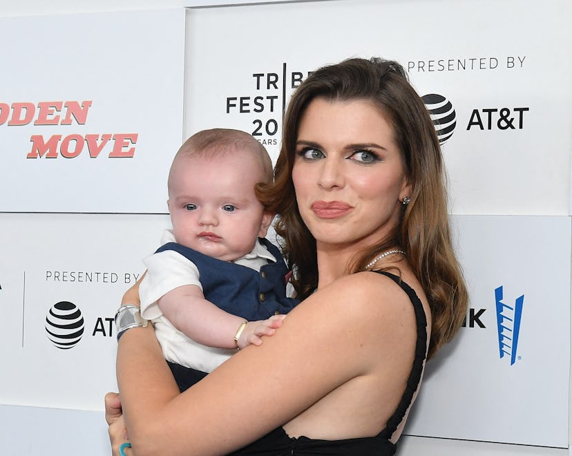 Italian-US actress Julia Fox holds her son Valentino as she attends the premiere of "No Sudden Move"...