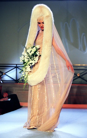NEW YORK, UNITED STATES:  A model wears a wedding dress with a fur wrap veil during the Bob Mackie F...