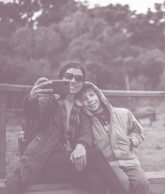 Mother and son taking a selfie in the natural park