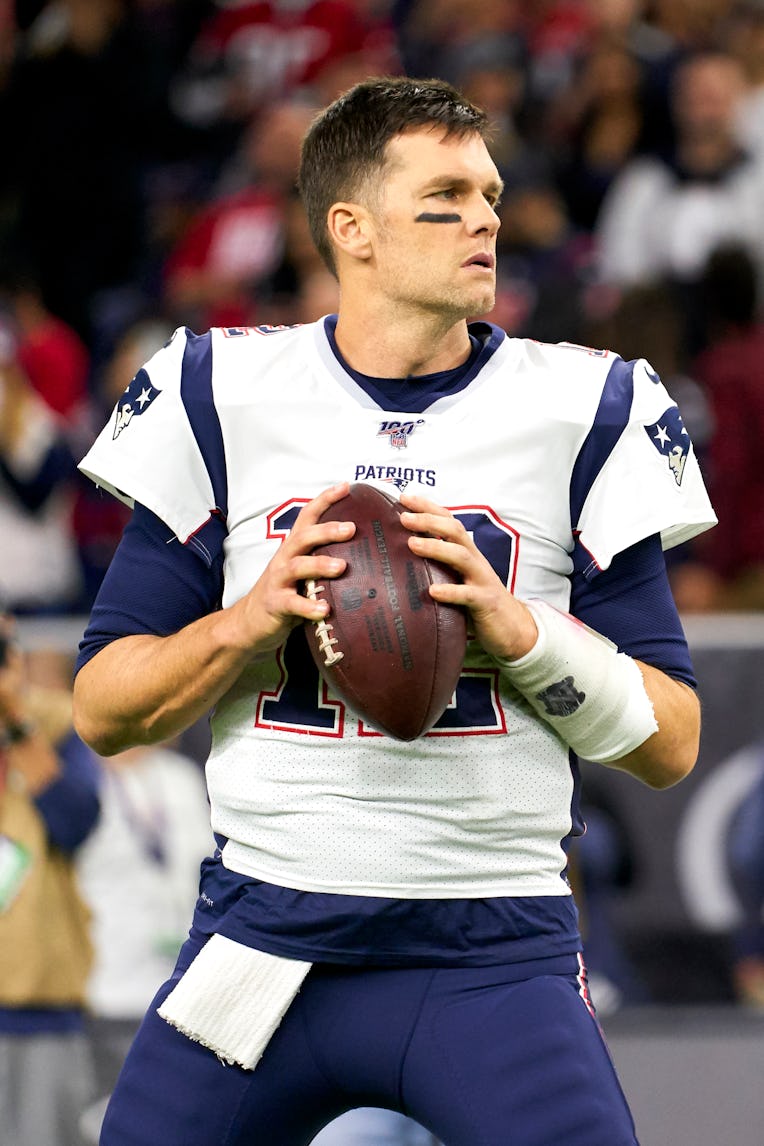 HOUSTON, TEXAS - DECEMBER 01: Tom Brady #12 of the New England Patriots warms up before an NFL footb...