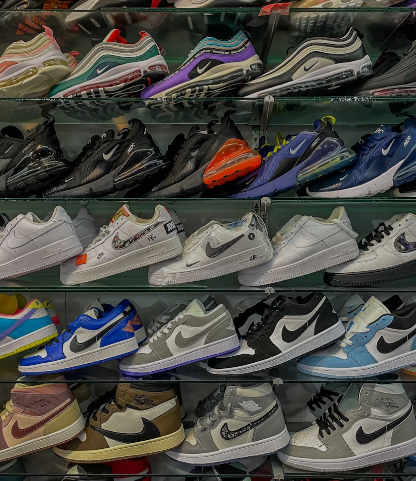 Phuket, Thailand - May 4, 2022: Rows of Counterfeit Fake Poor quality Trainers such as Nike Air Jord...