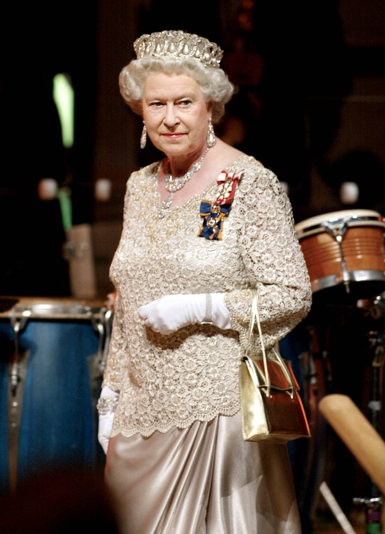 Britain's Queen Elizabeth II arrives for a gala dinner 13 October 2002 in Gatineau, Quebec, Canada. ...