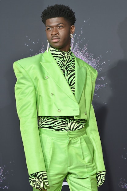 Lil Nas X Style Evolution: Lil Nas X in a green, neon suit at the 47th Annual AMA Awards on November...