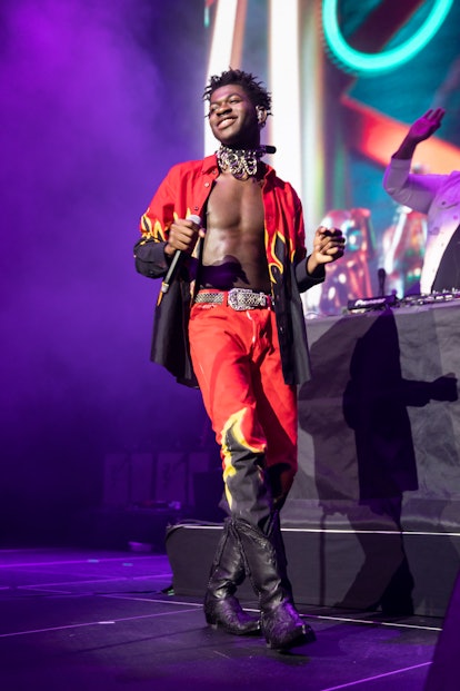 Lil Nas X Style Evolution: the rapper wore a matching flame set while performing at WiLD 94.9's FM's...