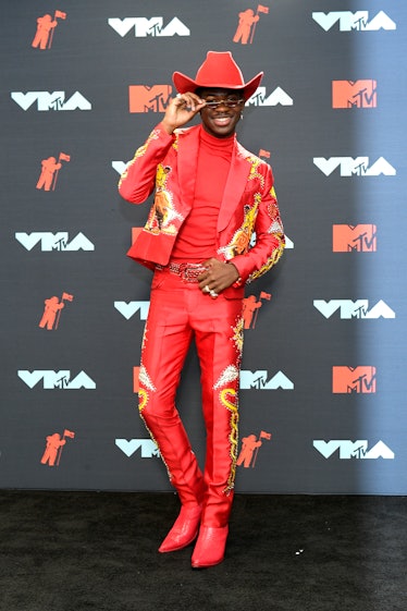 Lil Nas X Style Evolution: he wore a tiger-covered, red leather cowboy suit during the 2019 MTV Vide...