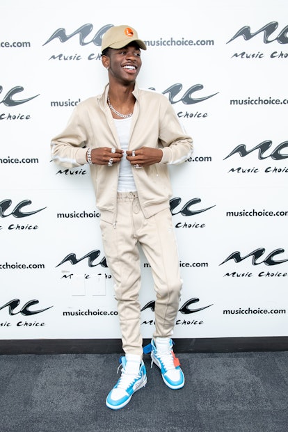 Lil Nas X Style Evolution: the rapper wore a beige set and white tank top on May 01, 2019.