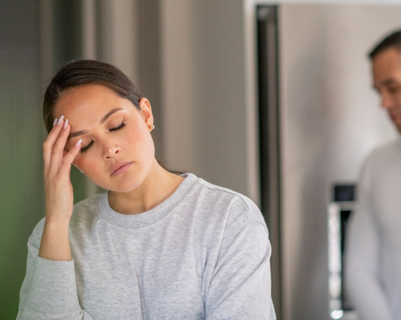 Young couple having a stressful argument while at home in their kitchen. how to tell your husband yo...