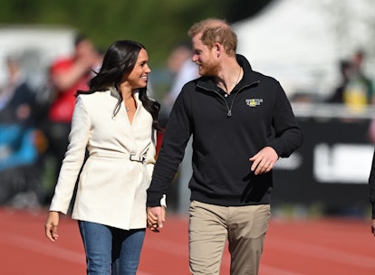 Prince Harry, Duke of Sussex and Meghan, Duchess of Sussex attend the athletics event during the Inv...