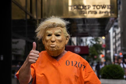 A protestor dressed up as former US President Donald Trump poses for photos outside Trump Tower in N...