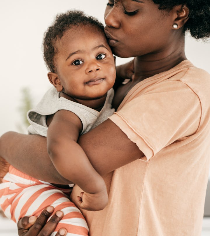 Baby and mom snuggling in an article about how long does a cold last in a baby?