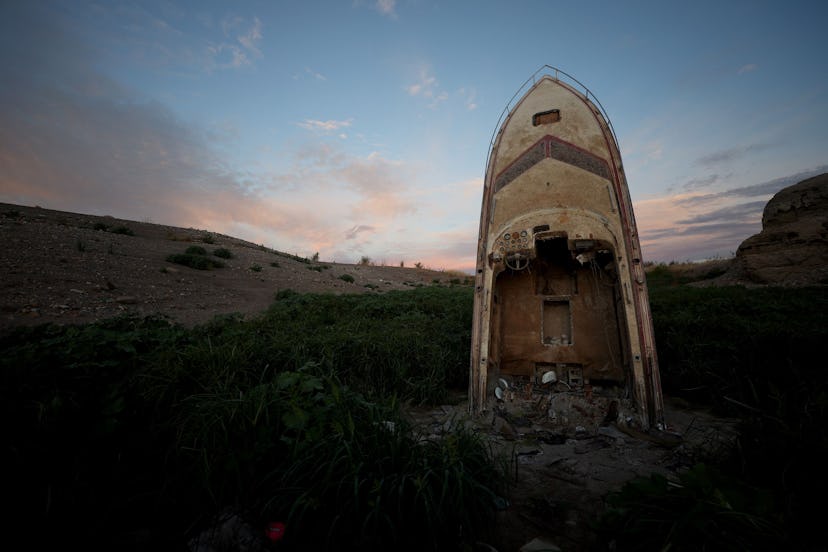 LAKE MEAD NATIONAL RECREATION AREA, NEVADA - AUGUST 19: A formerly sunken boat stands upright in a s...