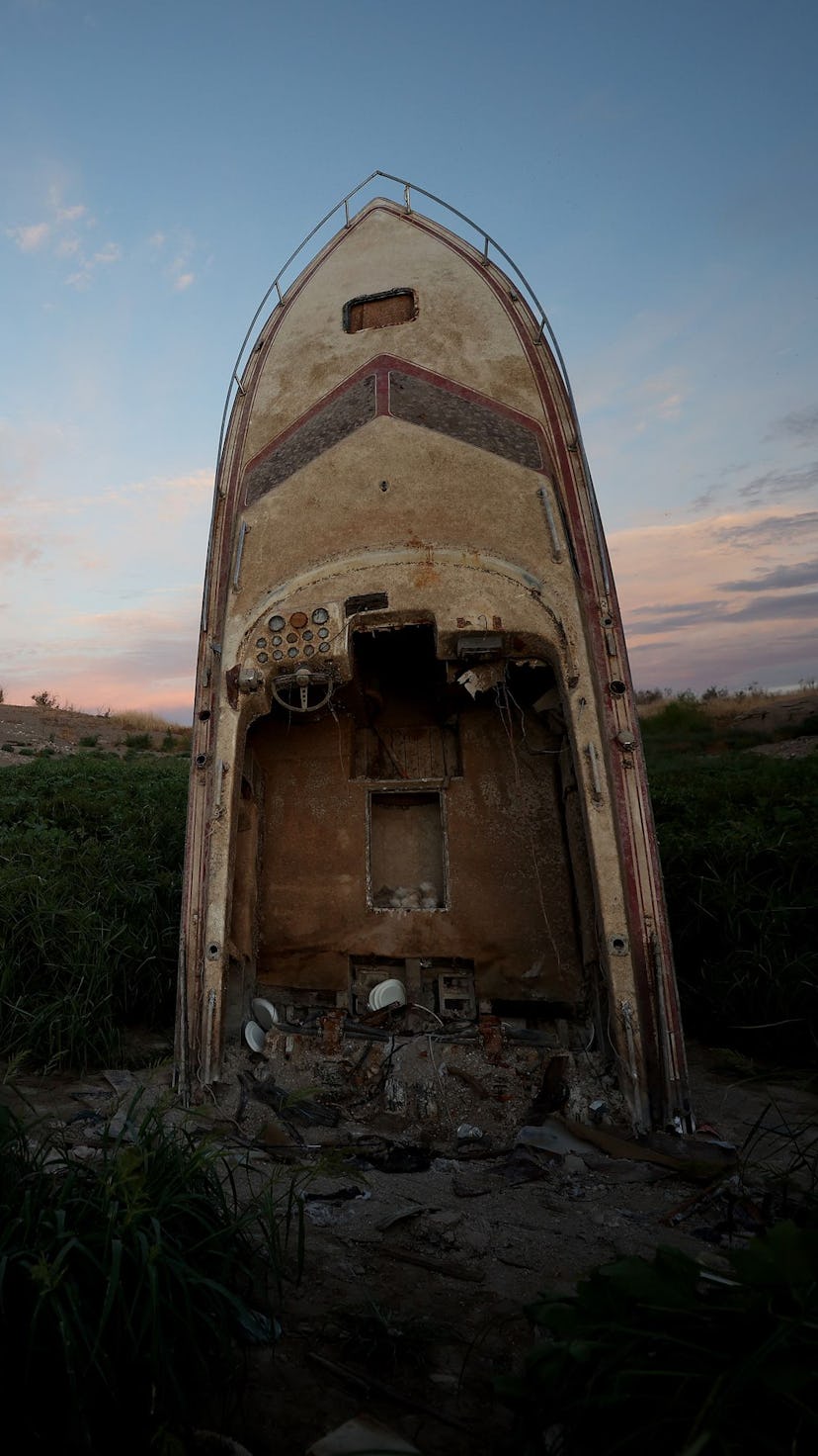LAKE MEAD NATIONAL RECREATION AREA, NEVADA - AUGUST 19: A formerly sunken boat stands upright in a s...