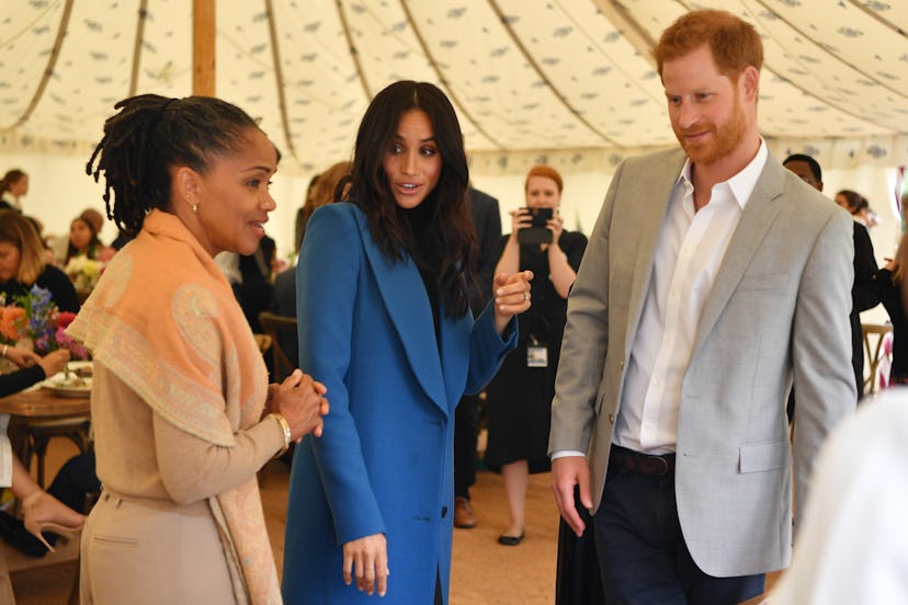 Meghan, Duchess of Sussex (C) arrives with her mother Doria Ragland (L) and Prince Harry, Duke of Su...