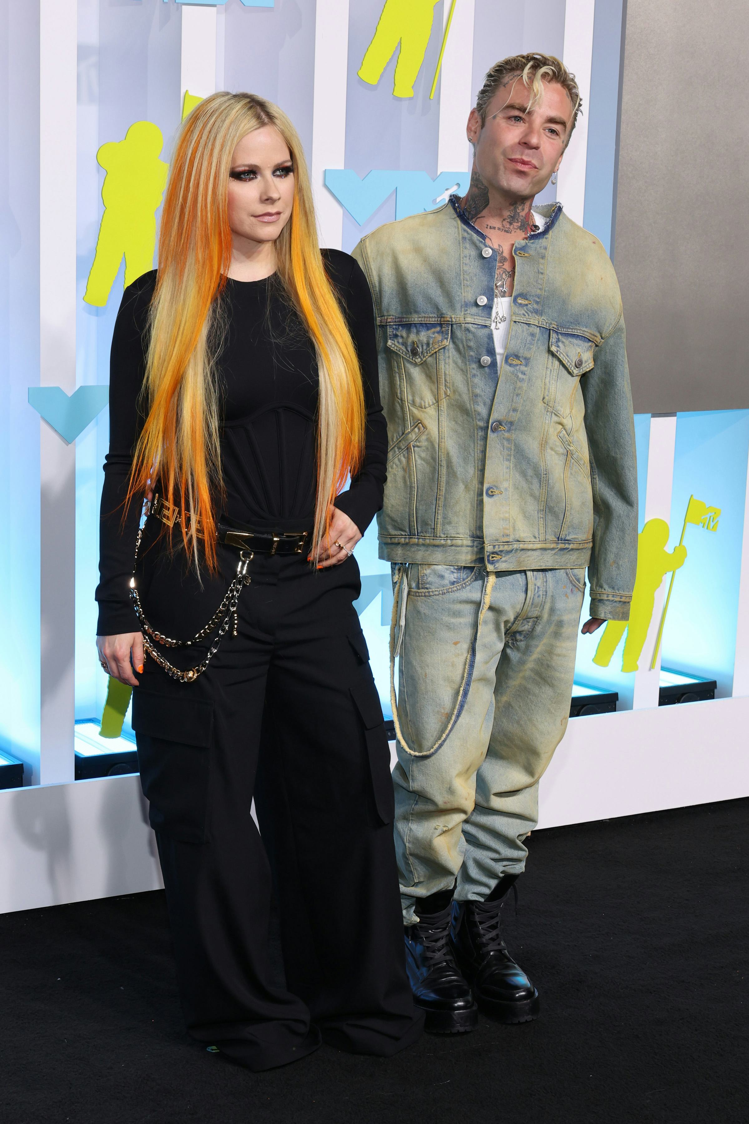 NEWARK, NEW JERSEY - AUGUST 28: (L-R) Avril Lavigne and Mod Sun attend the 2022 MTV VMAs at Prudenti...
