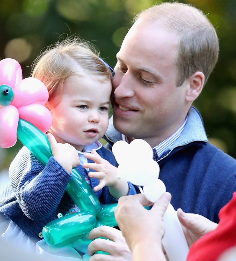Prince William plays with Princess Charlotte.