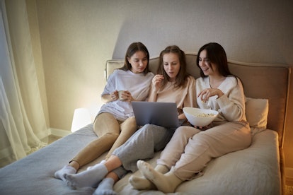 three young women having a girls night and using a funny Instagram location